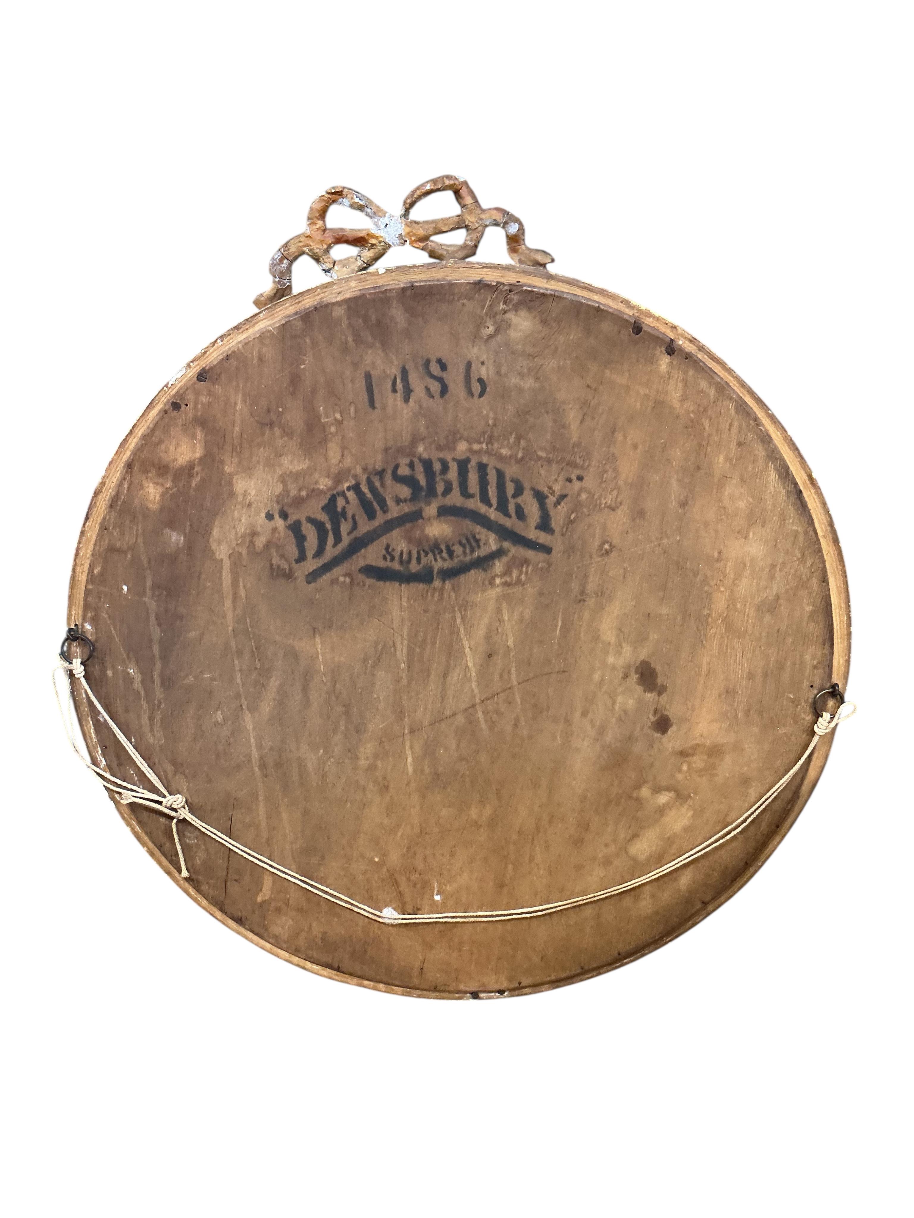 An early 20th century French giltwood and composition circular wall mirror, diameter 51cm, together with an Edwardian oval bevelled mirror and a Regency style wall mirror